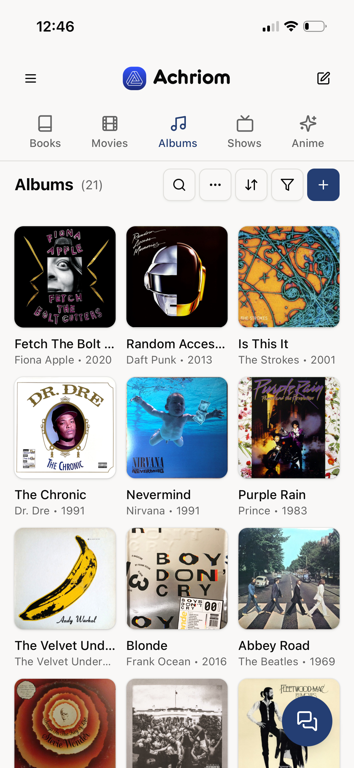 Achriom albums library alongside books, films and TV, on iPhone